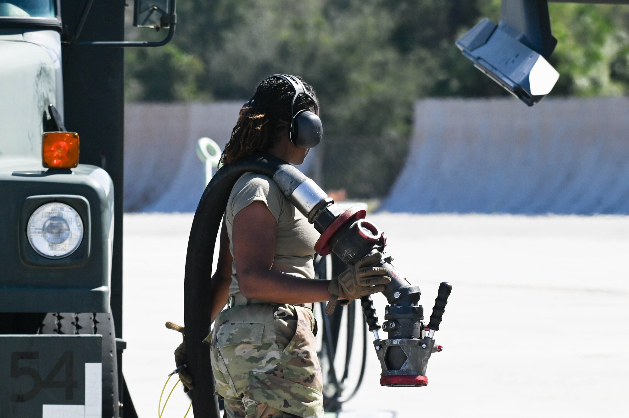 A photo of an Airman holding fuel pump.