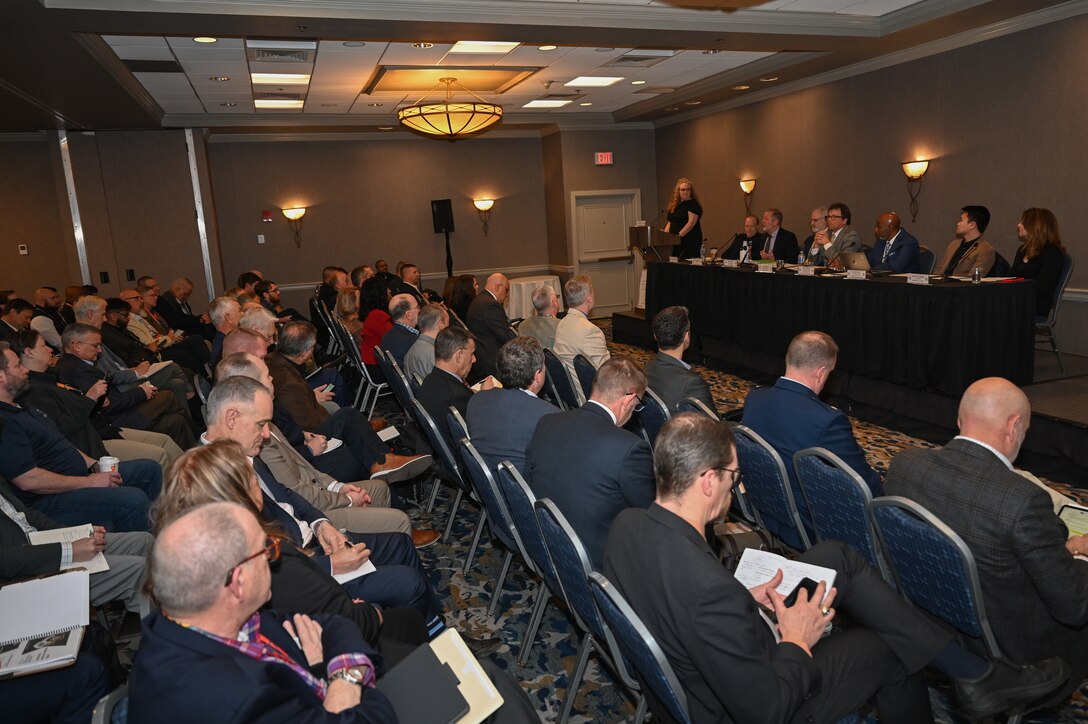 Image of people at a conference.