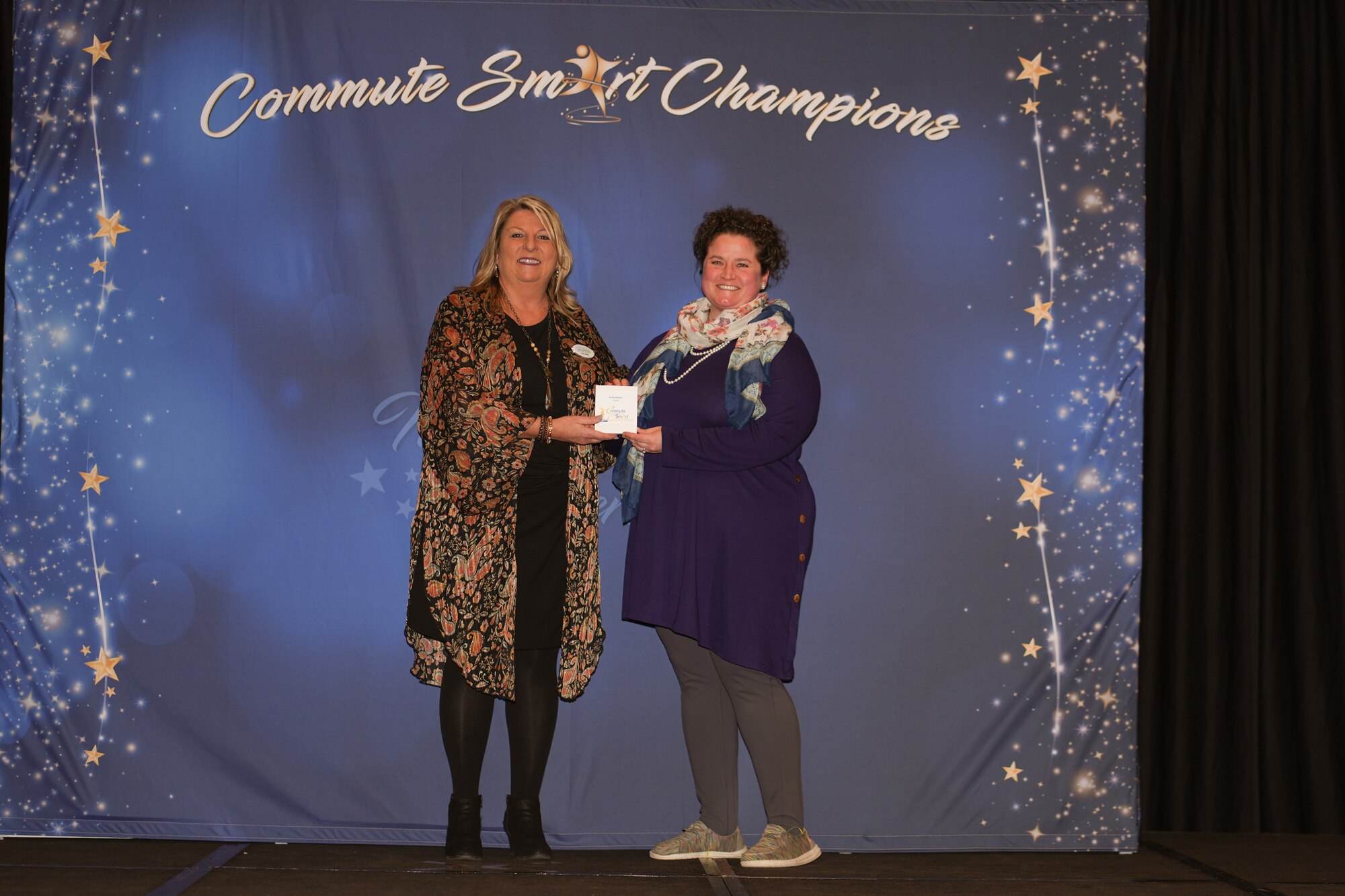 A woman receives an award