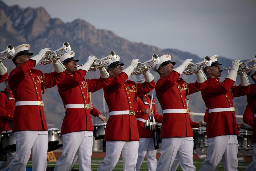 Marines with “The Commandant’s Own,” U.S. Marine Drum & Bugle Corps, conduct a musical sequence during a performance at V. Sue Cleveland High School, Albuquerque, NM., Mar. 6, 2024. The Battle Color Detachment has offically wrapped up their west coast tour. (U.S. Marine Corps photo by Lance Cpl. Chloe N. McAfee)