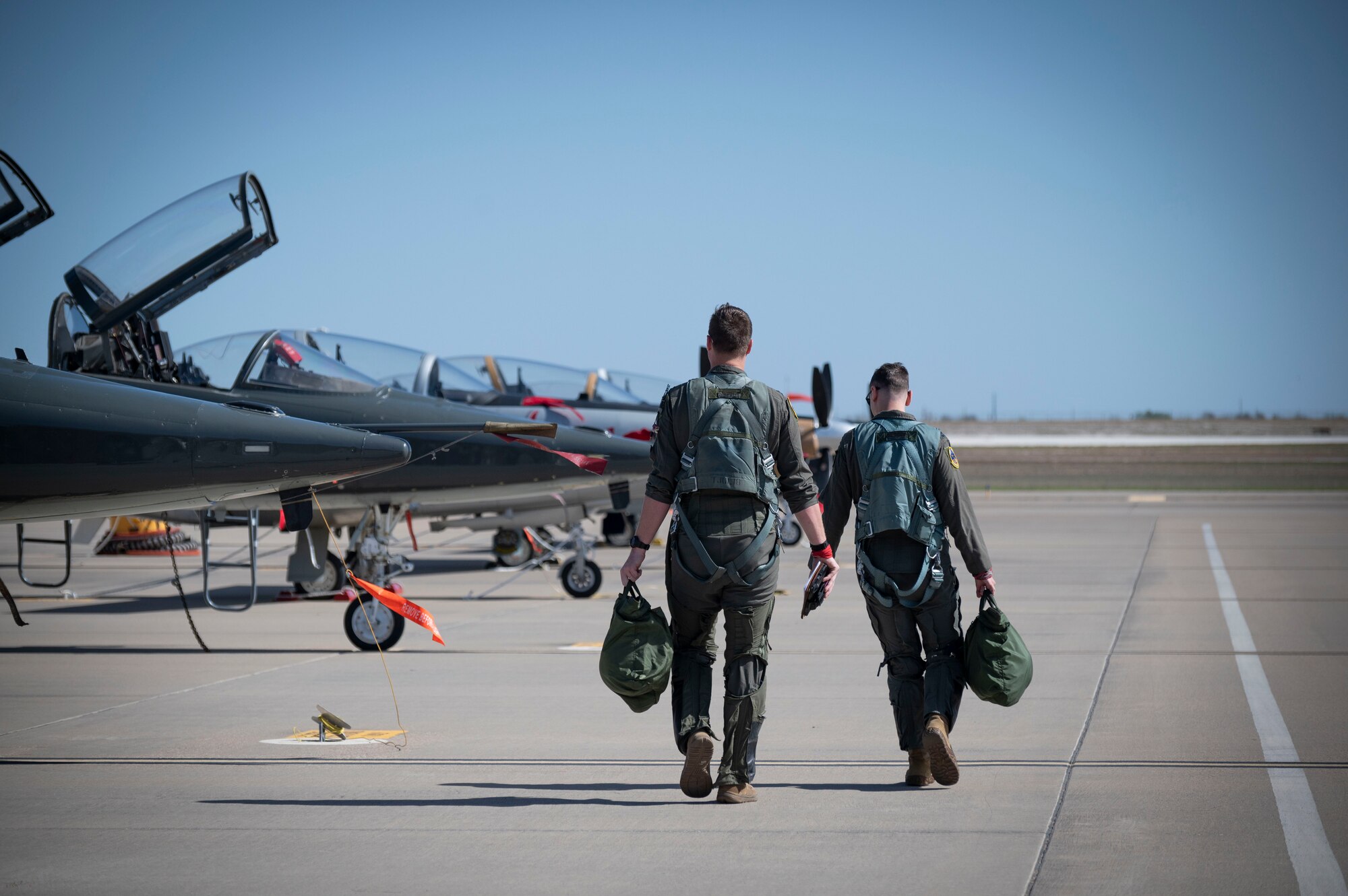 two Air Force Pilots walking to aircraft