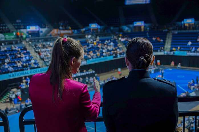 Sally Roberts, left, Chief Executive Officer and Co-founder of Wrestle Like A Girl, and U.S. Marine Corps Major General Roberta L. Shea, right, Legislative Assistant to the Commandant of the Marine Corps, Headquarters Marine Corps, watch the quarterfinals at the National Collegiate Women’s Wrestling Championships, Cedar Rapids, IA., March 8, 2024. The National Collegiate Women’s Wrestling Championship works with the Wrestle Like A Girl to promote female empowerment through the sport of wrestling.  (U.S. Marine Corps photo by Cpl. Collette Hagen)