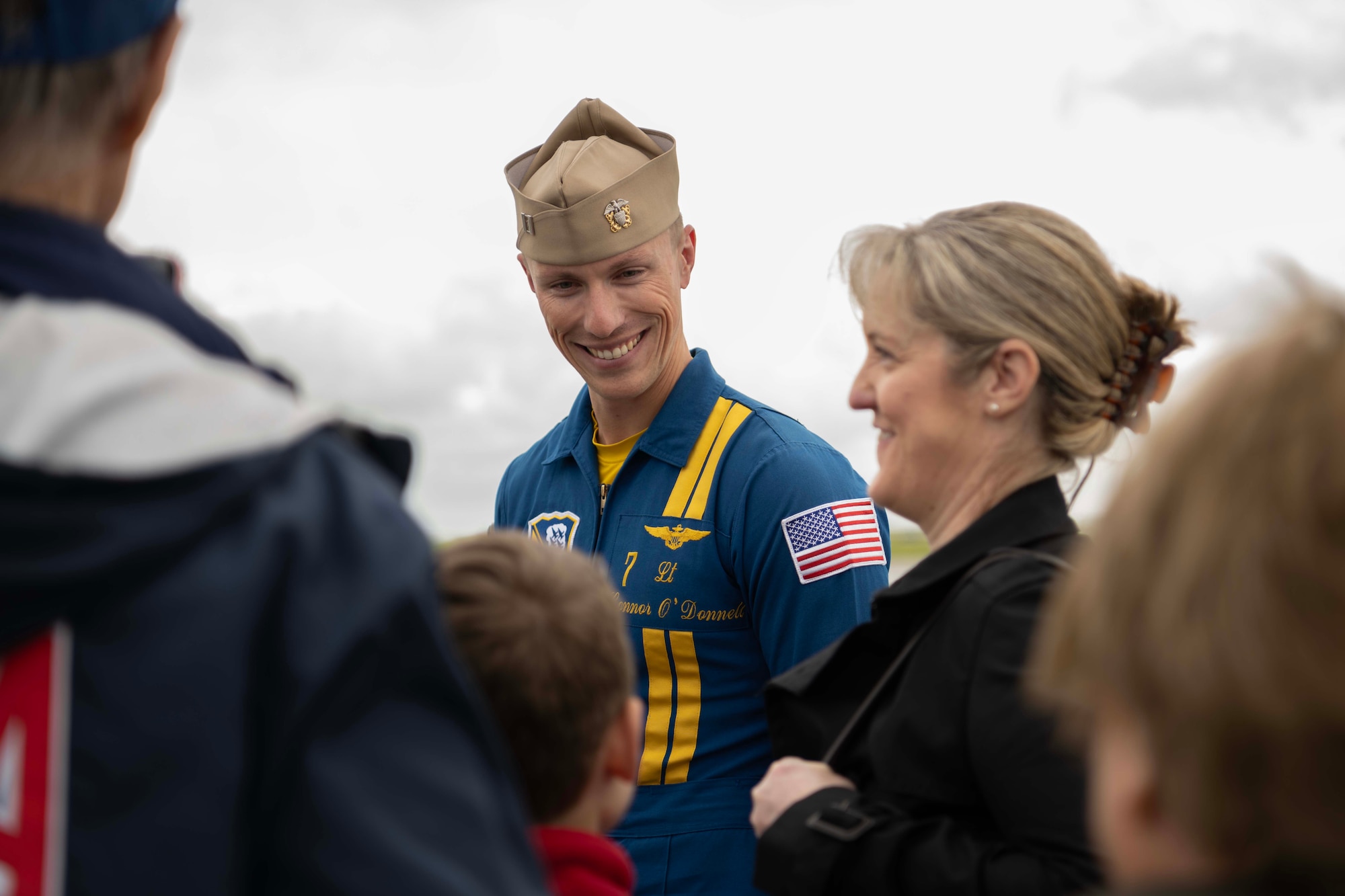A U.S. Navy Blue Angel pilot speaks with people