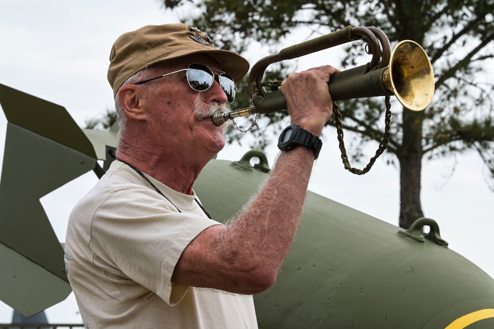 An attendee of the Jockey-14 Remembrance Ceremony plays taps at Hurlburt Field, Florida, Mar. 14, 2024. The ceremony was held as a reminder of those lost during the Jockey-14 crash, their sacrifices and their families’ enduring sacrifice. (U.S. Air Force photo by Senior Airman Ty Pilgrim)