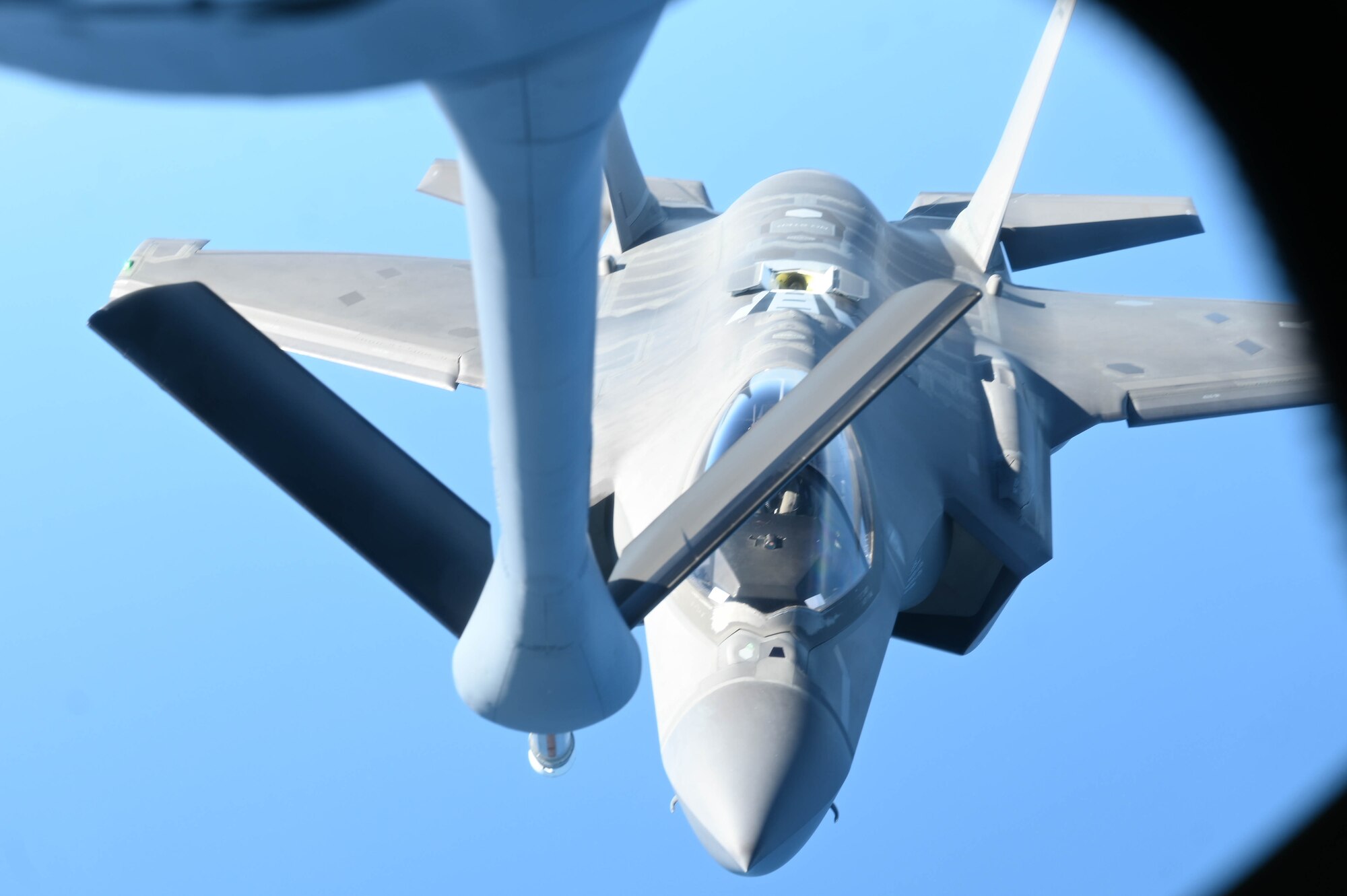 A photo of an F-35 receiving fuel.