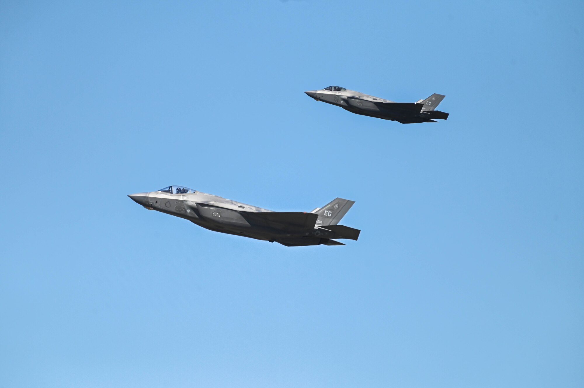 A photo of two F-35s.