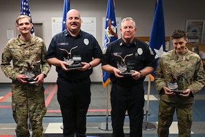 Four members of the 11th Security Forces Squadron pose with their Air Force District of Washington Outstanding Security Forces individual awards on Joint Base Anacostia-Bolling, Washington, D.C., March 12, 2024. From the left: U.S. Air Force Tech. Sgt. Kristopher Wayne, noncommissioned officer in charge of operations; police Sgt. Dylan Myers, Alpha flight sergeant; police Sgt. 1st Class Robert Cox, Alpha flight chief; and U.S. Air Force Master Sgt. Melinda Miller, Charlie flight chief, were recognized for their significant contributions to the Security Forces career field.