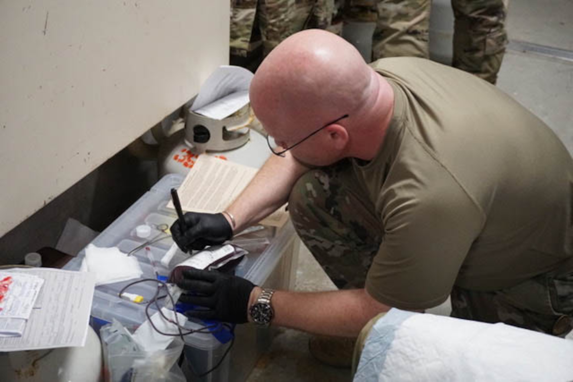 Airmen checks medical equipment