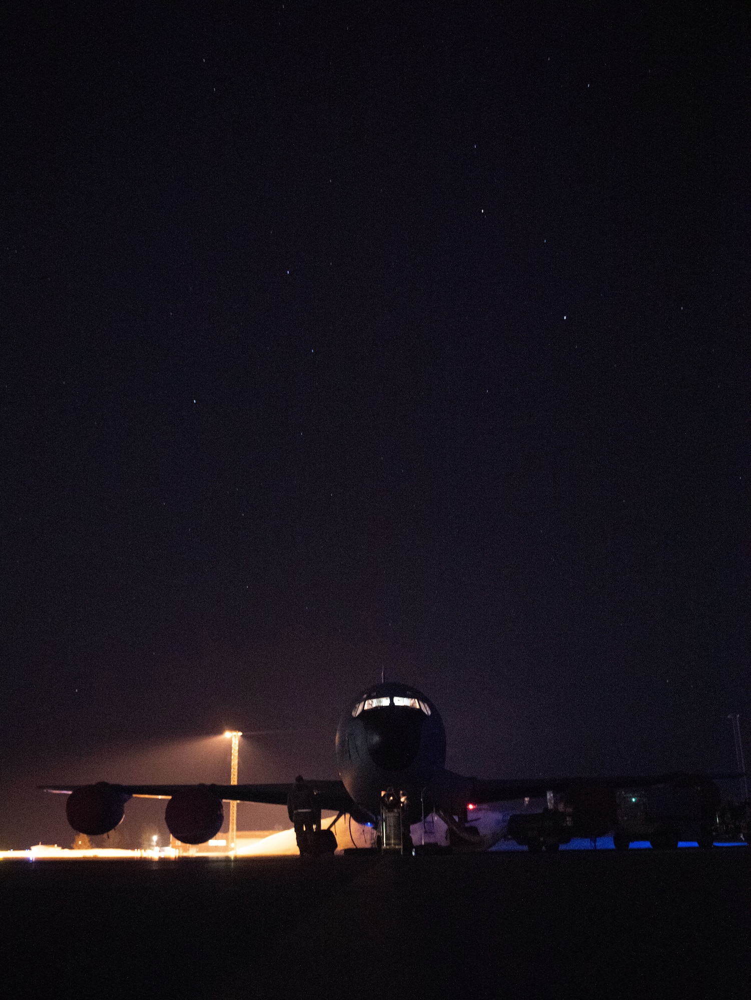A KC-135 photographed at night.