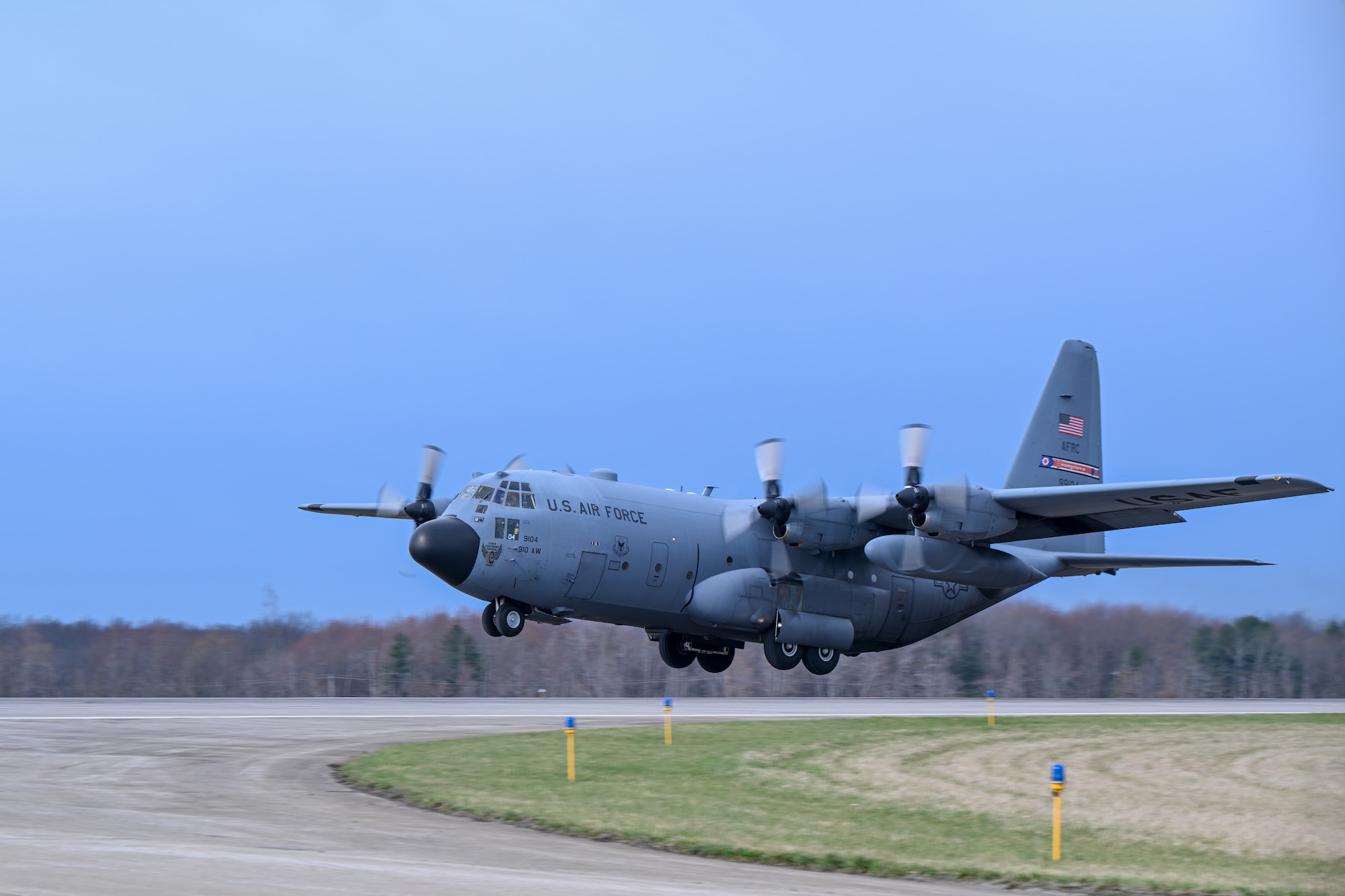 A C-130H Hercules aircraft assigned to the 910th Airlift Wing takes off from Youngstown Air Reserve Station, Ohio, for a local training flight, March 14, 2024.