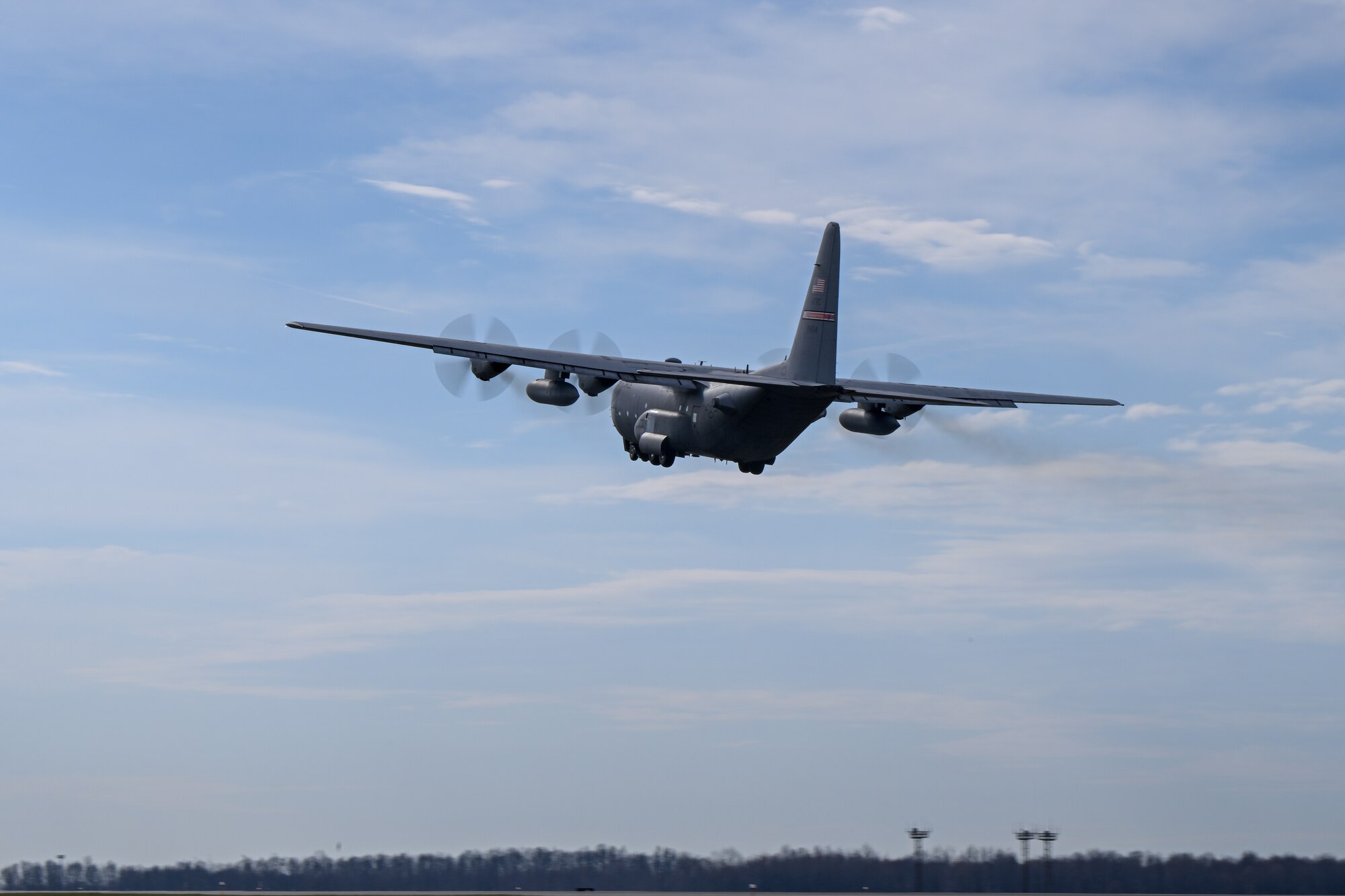 A pair of C-130H Hercules aircraft assigned to the 910th Airlift Wing soar toward the horizon after departing Youngstown Air Reserve Station, Ohio, for a local training flight, March 14, 2024.