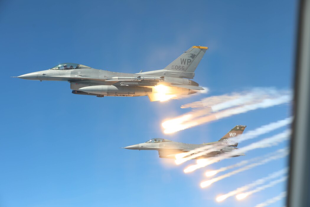 Two U.S. Air Force F-16 Fighting Falcons, assigned to the 8th Fighter Wing, deploy countermeasures