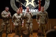 Maj. Gen. Gene. J. LeBeouf, deputy commanding general for Army Reserves Command, leads in applauding Maj. Julie Fishon and Sgt. 1st Class Craig Pienkoski, after they received awards during the Active Component to Reserve Component training held in the Soldier Support Institute’s auditorium, March 5, 2024.