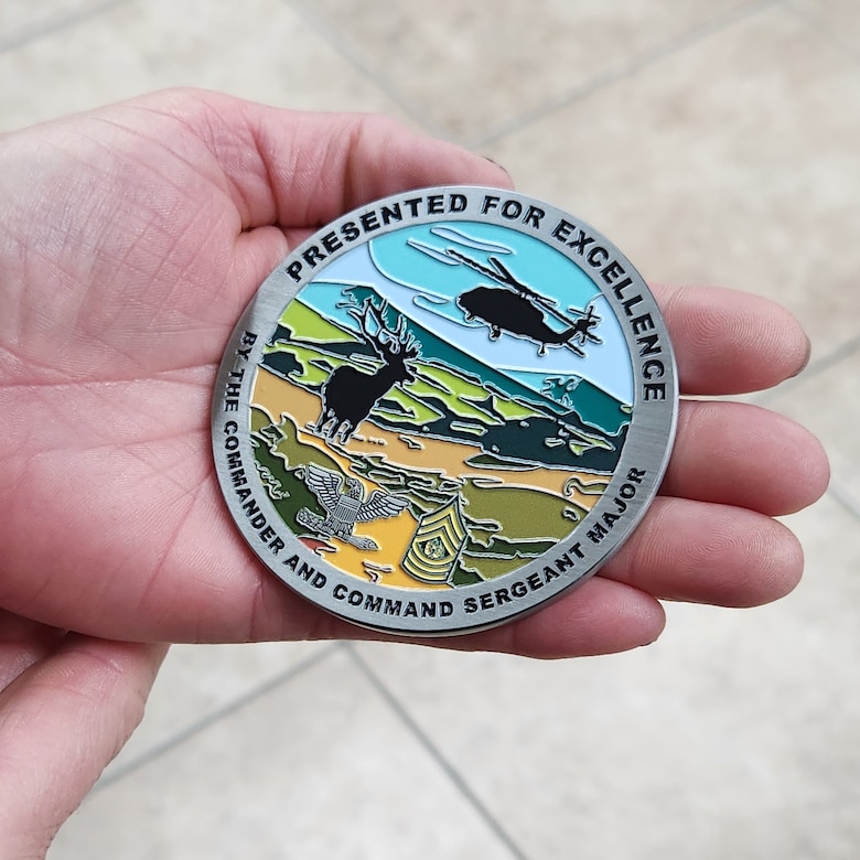 Fort Hunter Liggett challenge coin reflects military mission while depicting beauty of nature