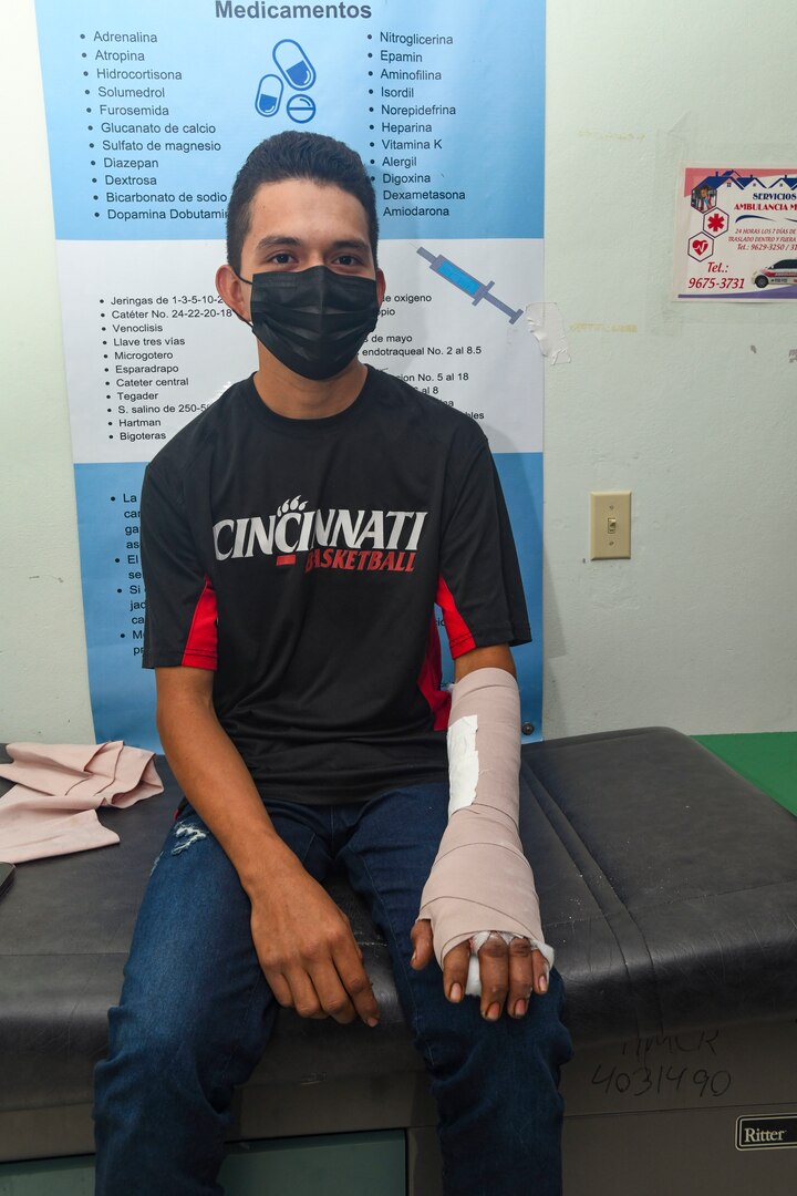 Reynaldo Muñoz, a 19-year-old Honduran resident, poses for a photo in the trauma bay of Hospital Nacional Mario Catarino Rivas after a successful operation  on Feb. 27, 2024. Muñoz was injured in an accident, but regained motion in his left index finger after two surgeons with Expeditionary Medical Unit (EMU) 10 G-Rotation 16 provided trauma care during a Global Health Engagement (GHE). EMU 10 G conducted its first GHE to enhance expeditionary core skills and knowledge exchange with Honduran healthcare professionals in a limited resource environment, Feb. 17 – March 2, 2024.