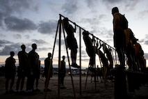 U.S. Marine Corps recruits with Golf Company, 2nd Recruit Training Battalion, conduct the pull-up portion of the Marine Corps Physical Fitness Test at Marine Corps Recruit Depot San Diego, California, March 11, 2024. The PFT is conducted during recruit training as an evaluation of stamina and physical conditioning. (U.S. Marine Corps photo by Sgt. Yvonna Guyette)