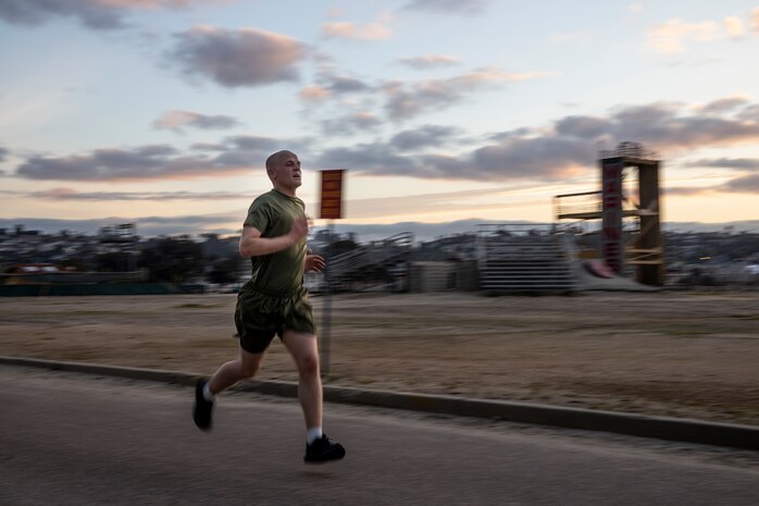 A U.S. Marine Corps recruit with Golf Company, 2nd Recruit Training Battalion, conducts the 3-mile run portion of the Marine Corps Physical Fitness Test at Marine Corps Recruit Depot San Diego, California, March 11, 2024. The PFT is conducted during recruit training as an evaluation of stamina and physical conditioning. (U.S. Marine Corps photo by Sgt. Yvonna Guyette)