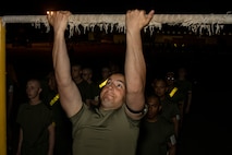 U.S. Marine Corps Recruit Gavin Gensicke, with Golf Company, 2nd Recruit Training Battalion, conducts the pull-up portion of the Marine Corps Physical Fitness Test at Marine Corps Recruit Depot San Diego, California, March 11, 2024. The PFT is conducted during recruit training as an evaluation of stamina and physical conditioning. (U.S. Marine Corps photo by Sgt. Yvonna Guyette)