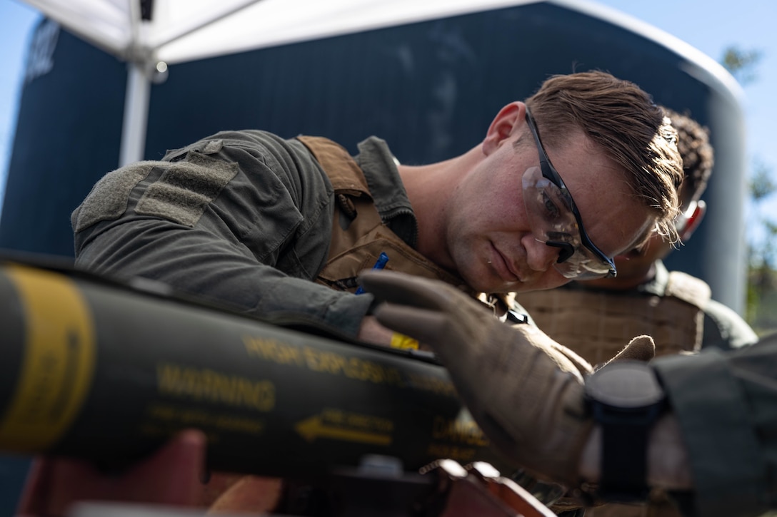 U.S. Marine Corps Sgt. Ethan Tuttle, a native of Castle Dale, Utah and an explosive ordnance disposal technician with 1st Explosive Ordnance Disposal Company,7th Engineer Support Battalion, 1st Marine Logistics Group, cuts glue off of an ordnance item during an explosive ordnance exploitation training evolution on Camp Pendleton, California, Jan. 30, 2024. This training is used to help implement and improve techniques and methods required to efficiently and safely dispose of ordnance.  (U.S. Marine Corps photo by Cpl. Savannah Norris)