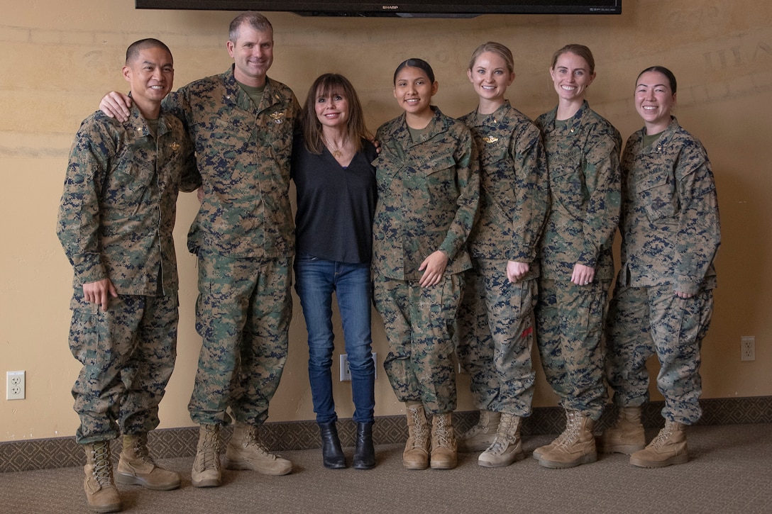 Heidi Murkoff, author of the “What to Expect When You're Expecting" pregnancy guides, takes a photo with U.S. Marines and Sailors with 1st Marine Logistics Group during an educational guest speaker event hosted by the Artemis program at Camp Pendleton, California, Nov. 29, 2023. Artemis is a Navy medicine and research informed program for female Marines and Sailors throughout their prenatal and postpartum experiences, helping them mentally and physically prepare to return to full duty. (U.S. Marine Corps photo by Lance Cpl. Kiana Rose Orinion)