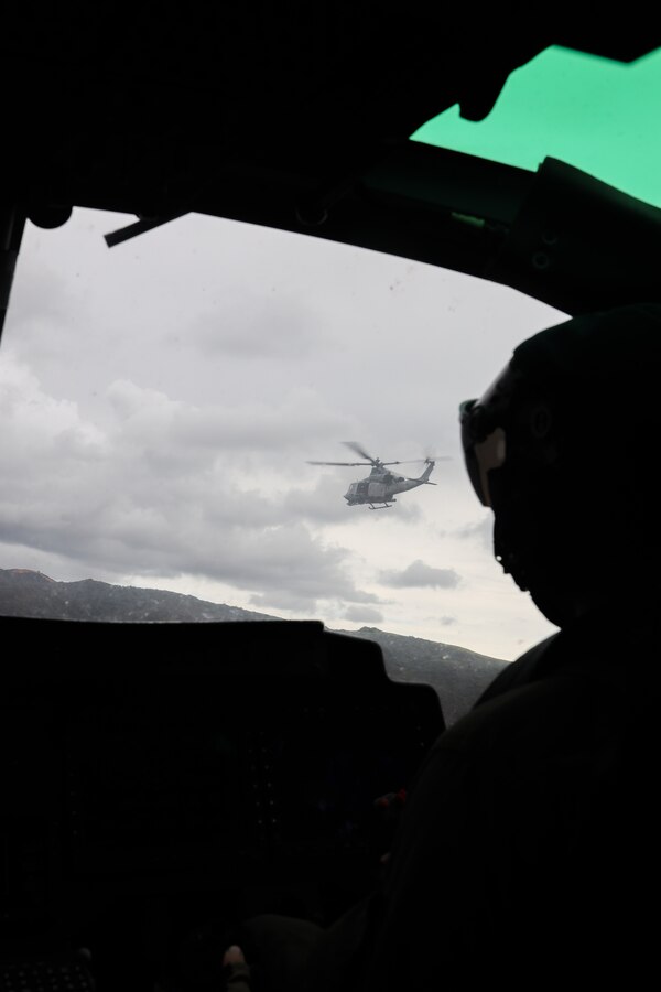 A U.S. Marine Corps UH-1Y Venom with Marine Light Attack Helicopter Squadron (HMLA) 169, Marine Aircraft Group 39, 3rd Marine Air Wing, flies in formation during a familiarization tour with U.S. Marine Corps Lt. Gen. Michael S. Cederholm, commanding general of I Marine Expeditionary Force, at Camp Pendleton, California, March 6, 2024.   Cederholm assumed command of I MEF in February 2024. He has flown operational tours in all four Marine Aircraft Wings and flown every operational type-model aircraft in the Marine Corps inventory, to include the F-35B, CH-53K, and VH-92.  (U.S. Marine Corps photo by Lance Cpl. Nicholas Johnson)