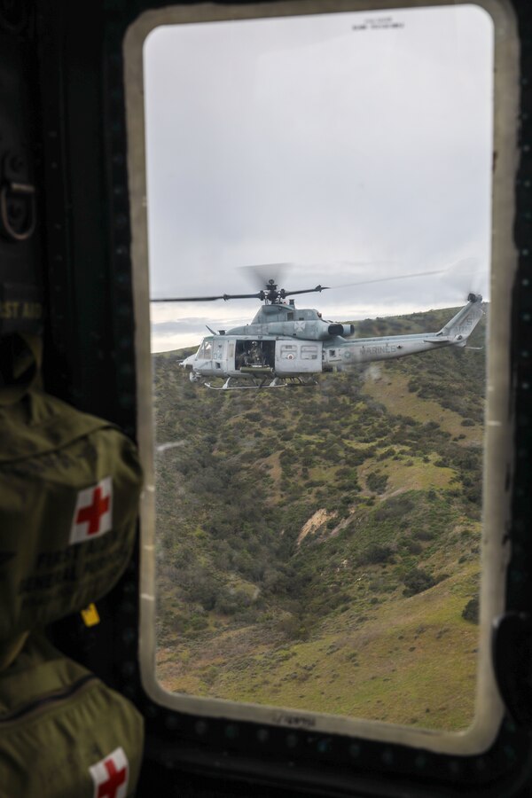 A U.S. Marine Corps UH-1Y Venom with Marine Light Attack Helicopter Squadron (HMLA) 169, Marine Aircraft Group 39, 3rd Marine Air Wing, flies over Camp Pendleton during a familiarization tour of Camp Pendleton, California, with U.S. Marine Corps Lt. Gen. Michael S. Cederholm, commanding general of I Marine Expeditionary Force, March 6, 2024.  Cederholm assumed command of I MEF in February 2024. He has flown operational tours in all four Marine Aircraft Wings and flown every operational type-model aircraft in the Marine Corps inventory, to include the F-35B, CH-53K, and VH-92.  (U.S. Marine Corps photo by Lance Cpl. Nicholas Johnson)