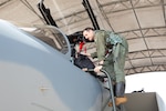 Lt. Col. Joel Thesing, 123rd Fighter Squadron pilot, climbs into an F-15 EX at Eglin Air Force Base, Fla., March 7, 2024. Thesing is the first Portland, Ore.-based pilot to fly and train in the EX.