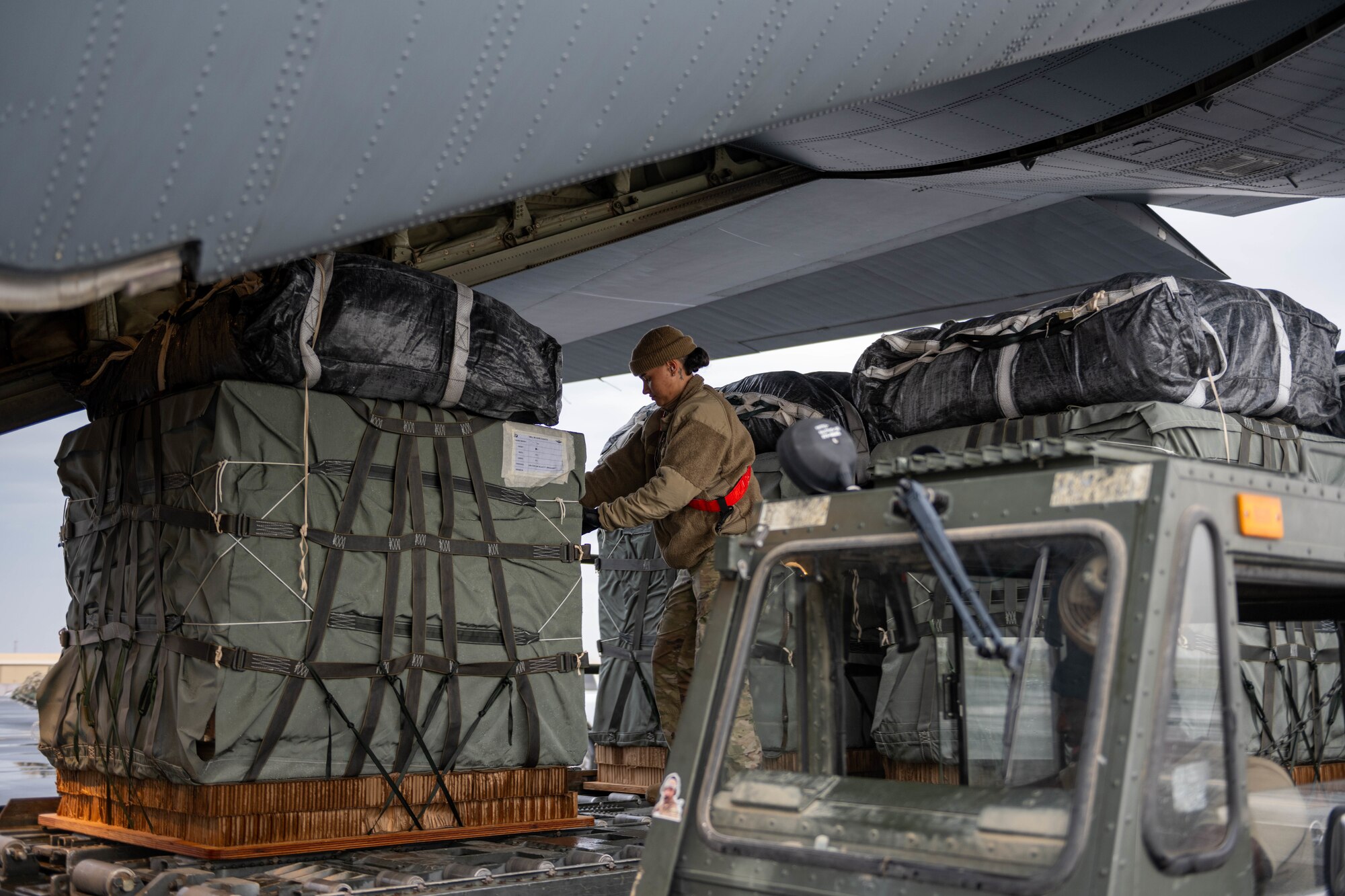 Airmen load humanitarian aid bound for airdrop over Gaza.