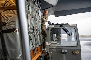 Airmen load pallets of humanitarian aid destined for airdrop over Gaza.