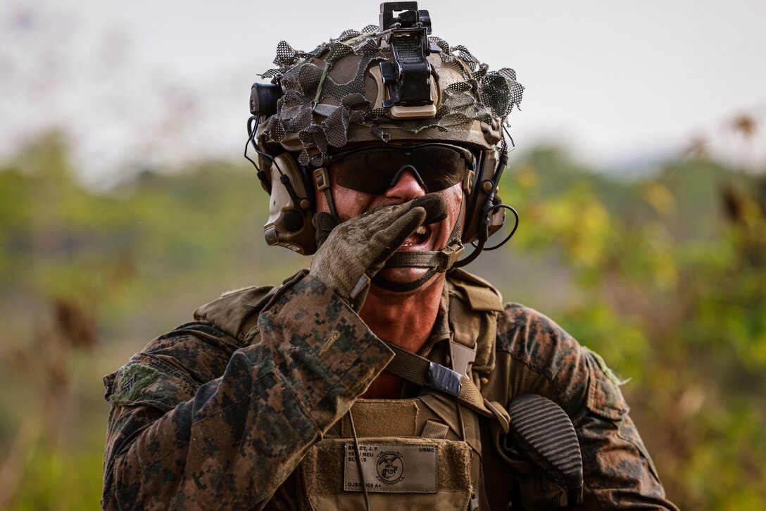 U.S. Marine Corps Cpl. Jason Briley, a squad leader assigned to Weapons Company, Battalion Landing Team 1/5, 15th Marine Expeditionary Unit, calls out directions during a live-fire training event as part of Exercise Cobra Gold in Chanthaburi province, Thailand, March 3, 2024. Cobra Gold, now in its 43rd iteration, demonstrates ongoing readiness to operate throughout the region in support of allies and partners to ensure a free and open Indo-Pacific. (U.S. Marine Corps photo by Cpl. Aidan Hekker)