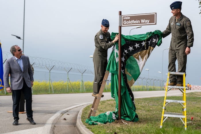 Retired Gen. David L. Goldfein, 21st Chief of Staff of the Air Force, is presented with a surprise road renaming ceremony.