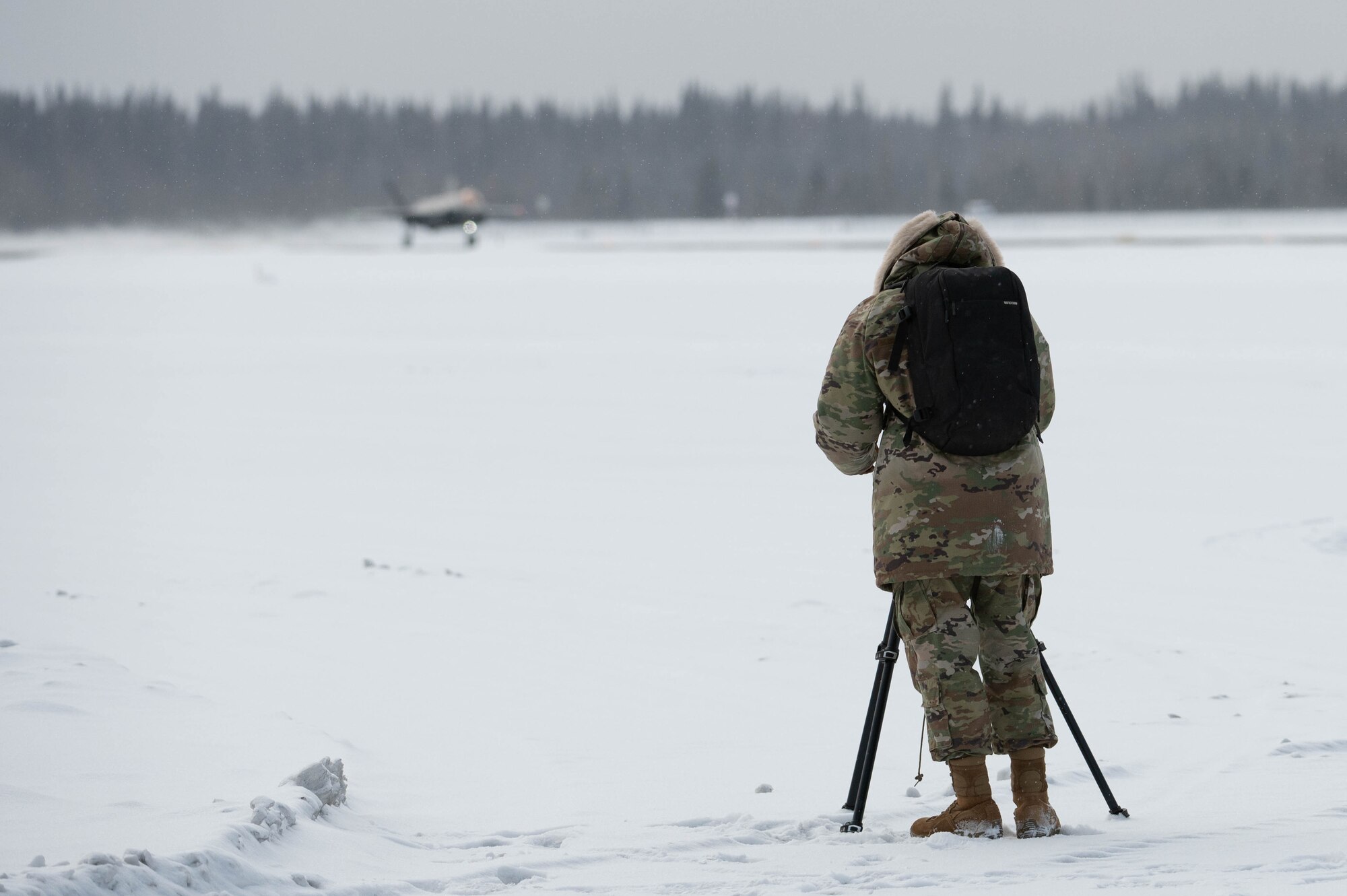 U.S. Air Force Airman Spencer Hanson, 354th Fighter Wing public affairs specialist, captures imagery of an F-35A Lightning II as it taxis on the flightline for a routine training at Eielson Air Force Base, Alaska, March 14, 2024.