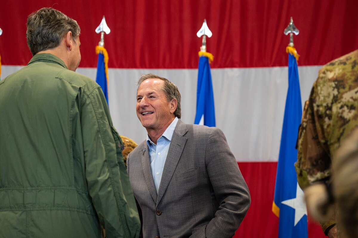 Retired Gen. David Goldfein, 21st Chief of Staff of the Air Force, speaks to Italian air force Col. Salvatore La Luce, ITAF base commander.