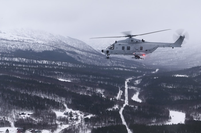 A helicopter flies over Norway.