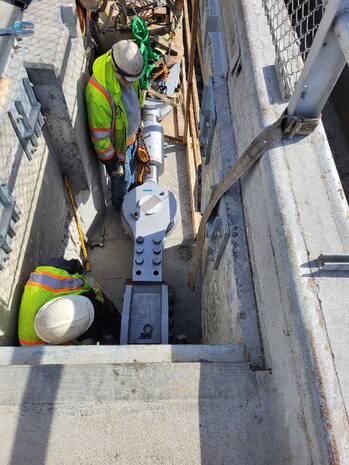 Contractor has completed installing the new “land side” gate linkage and is starting on the “river side” linkage.
