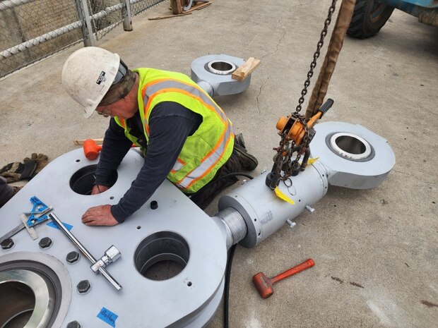 Contractor has completed installing the new “land side” gate linkage and is starting on the “river side” linkage.