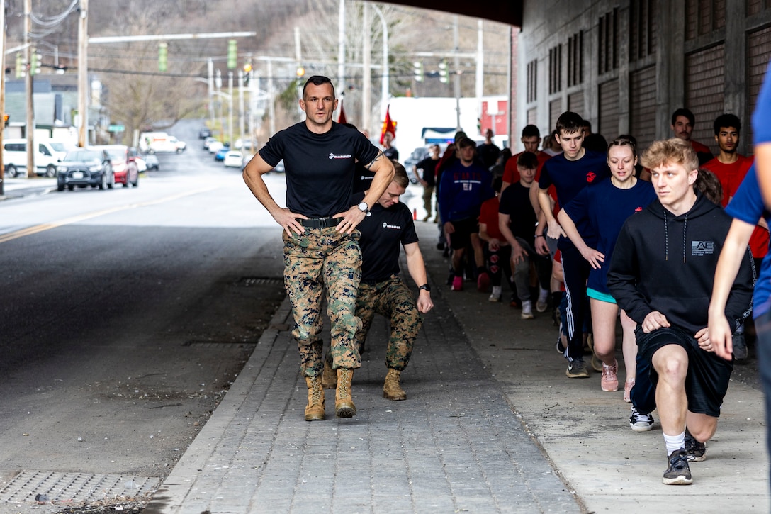 The American Warrior Festival hosted a workout event with U.S Marines from Recruiting Station Albany at Blood Iron Barbell, Syracuse, New York, Mar. 9, 2024, as part of their Military Mentorship / Training Mission.