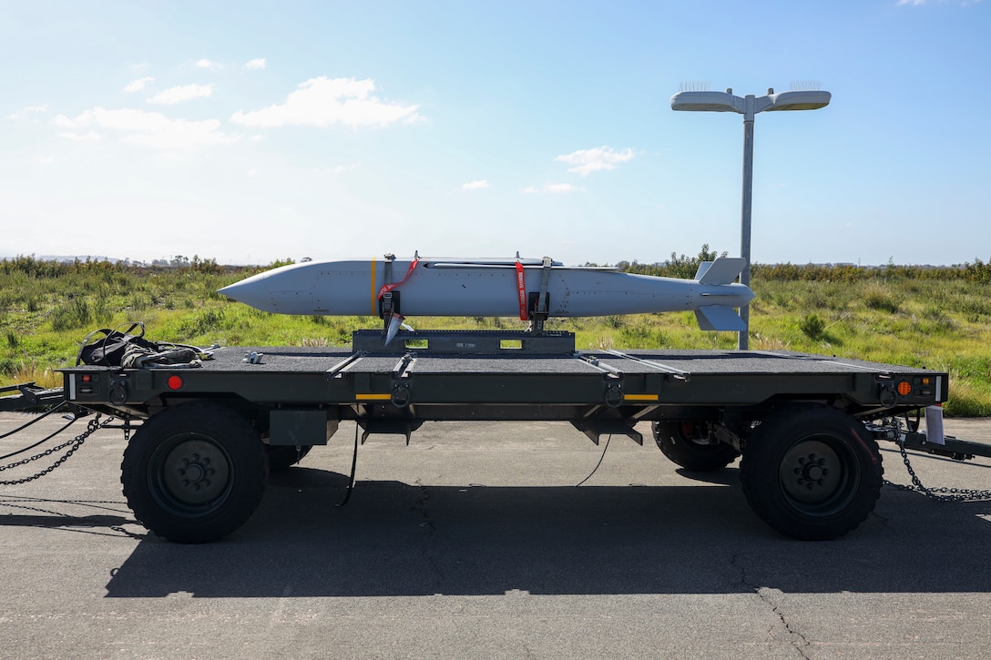 An AGM-154 Joint Standoff Weapon (JSOW) is staged on the flight line before being loaded a onto a F-35C Lightning II at Marine Corps Air Station Miramar, California, March 8, 2024. The JSOW is a fire-and-forget medium-range precision guided weapon intended for use against soft targets. This loading of the JSOW is the first loading of the weapon system on the F-35C and the first time being loaded in a garrison environment in nearly 20 years. (U.S. Marine Corps photo by Sgt. Sean Potter)