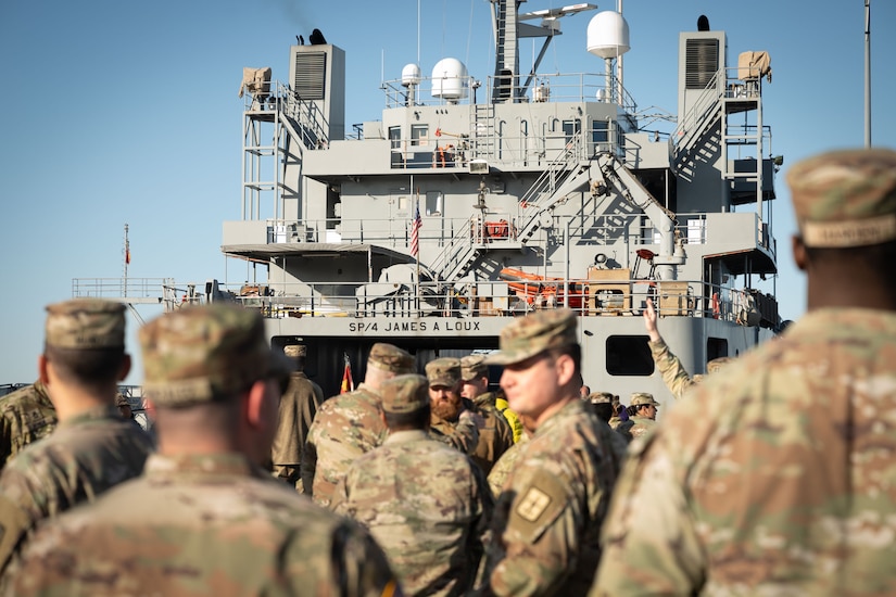 U.S. Army Soldiers from the 7th Transportation Battalion gather to ship out to Gaza to provide joint logistics over the shore capabilities in support of humanitarian aid to Gaza at Joint Base Langley-Eustis, V.A., March 12, 2024. The Army mariner’s logistics support vessel can carry and deploy supplies without going ashore through its Trident Pier system. (U.S. Air Force photo by Senior Airman Jack LeGrand)