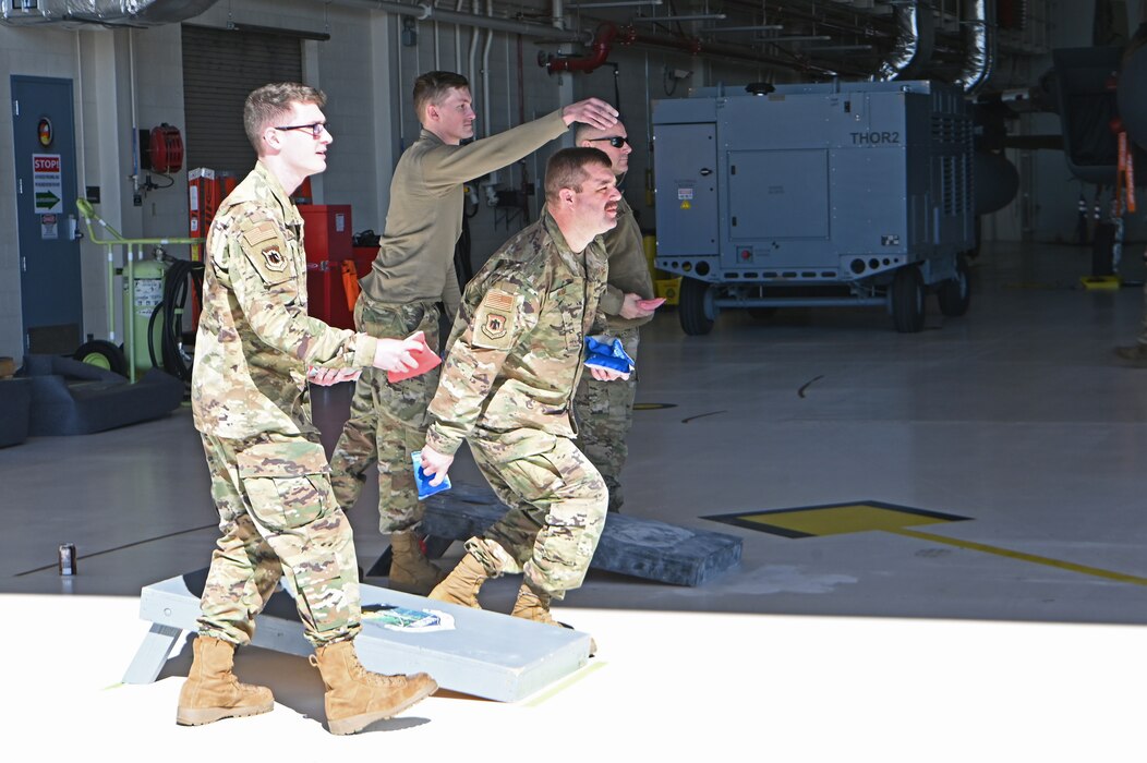 Airmen playing cornhole