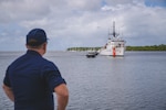 U.S. Coast Guard Cutter Harriet Lane (WMEC 903) crew members pull in slack on an aft mooring line to secure the cutter to a pier at HMAS Cairns, Queensland, Australia, March 7, 2024. The Harriet Lane made a five-day port call in Cairns during its inaugural Operation Blue Pacific patrol in Oceania. (U.S. Coast Guard photo by Petty Officer 2nd Class Ty Robertson)