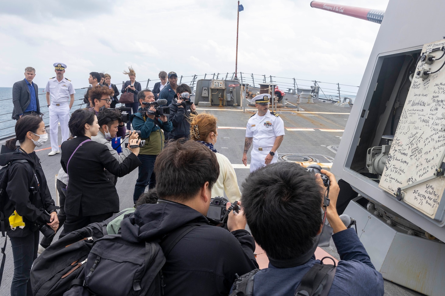 ISHIGAKI, Japan (Mar. 11, 2024) Lt. Chris Lelah, plans and tactics officer aboard the Arleigh Burke-class guided-missile destroyer USS Rafael Peralta (DDG 115), gives local media a tour of Rafael Peralta (DDG 115) in Ishigaki, Japan during a regularly scheduled port visit. Rafael Peralta is the first United States destroyer to visit Ishigaki. Rafael Peralta is forward-deployed and assigned to Destroyer Squadron (DESRON) 15, the Navy’s largest DESRON and the U.S. 7th Fleet’s principal surface force. (U.S. Navy photo by Mass Communication Specialist 1st Class Devin Monroe)