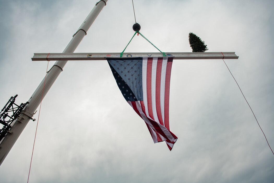 An American Flag hangs off a support beam.