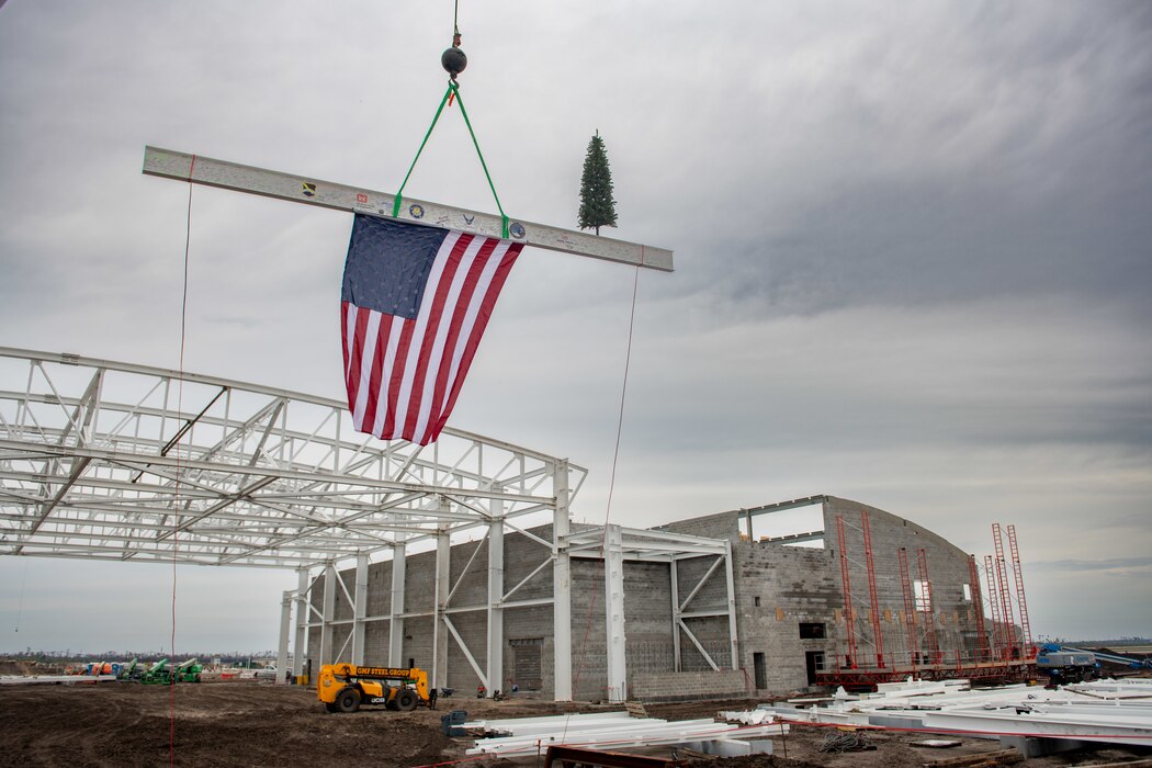 An American flag hangs from a support beam.