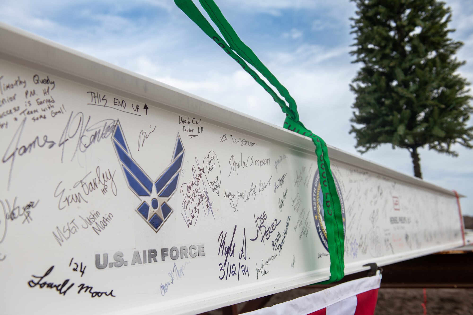 A support beam with signatures.