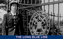 Edith Munro in her dress blue uniform strolling the grounds at the U.S. Coast Guard Academy. (U.S. Coast Guard)