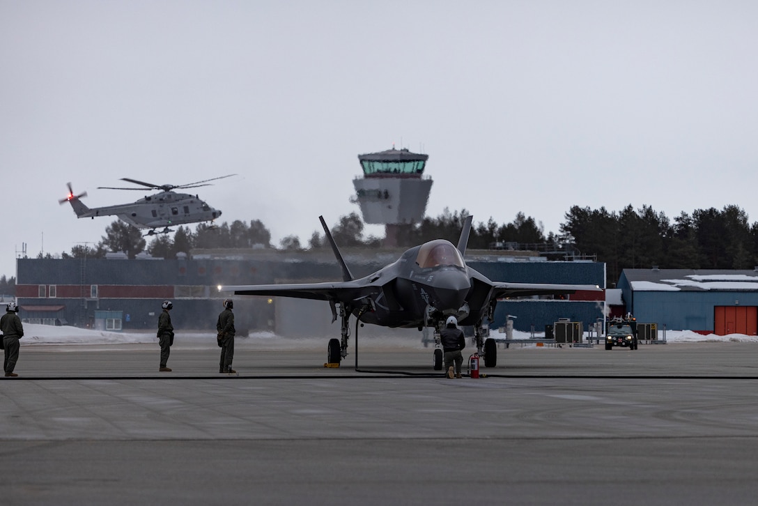 U.S. Marines with Marine Aerial Refueler Transport Squadron (VMGR) 252, 2nd Marine Aircraft Wing (MAW), refuel an F-35B Lightning II jet with Marine Fighter Attack Squadron (VMFA) 542, 2nd MAW, using aviation-delivered ground refueling during Exercise Nordic Response 24 in Lulea, Sweden, March 13, 2024. VMFA-542 and VMGR-252 demonstrated aviation-delivered ground refueling during a distributed aviation operation to showcase expeditionary advanced-base operations using host-nation support. The training event marked the first U.S. F-35 landing in Sweden at Kallax Air Base. Exercise Nordic Response 24 is designed to enhance military capabilities and allied cooperation in high-intensity warfighting scenarios under challenging arctic conditions while providing U.S. Marines unique opportunities to train alongside NATO allies and partners. (U.S. Marine Corps photo by Lance Cpl. Orlanys Diaz Figueroa)
