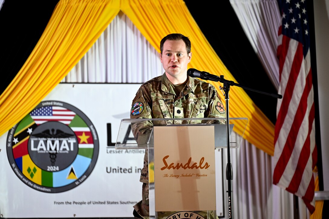 U.S. Air Force Lt. Col. Devin Watson, troop commander, gives remarks during the closing ceremony for the Lesser Antilles Medical Assistance Team mission in Castries, St. Lucia, March 6, 2024. Watson said the mission was the pinnacle of his military and professional career, as it provided him and the LAMAT team an opportunity to gain critical knowledge and build lasting relationships. (U.S. Air Force photo by Staff Sgt. Madeline Herzog)