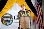 U.S. Air Force Lt. Col. Devin Watson, troop commander, gives remarks during the closing ceremony for the Lesser Antilles Medical Assistance Team mission in Castries, St. Lucia, March 6, 2024. Watson said the mission was the pinnacle of his military and professional career, as it provided him and the LAMAT team an opportunity to gain critical knowledge and build lasting relationships. (U.S. Air Force photo by Staff Sgt. Madeline Herzog)