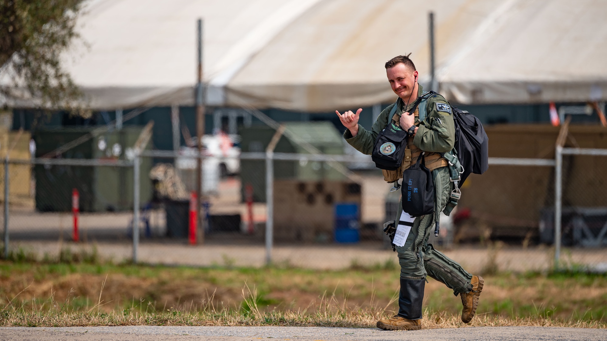 Lt. Col. Eric Broyles walks across the flightline towards an F-16 Fighting Falcon for a routine flight ahead of Cope Tiger 24